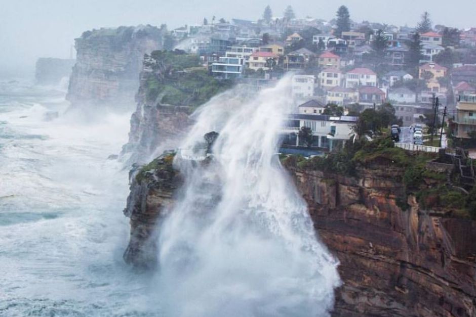 Waves crashing over a cliff near Sydney during an East Coast Low in June 2016. Image via Jacob Ze Zwart